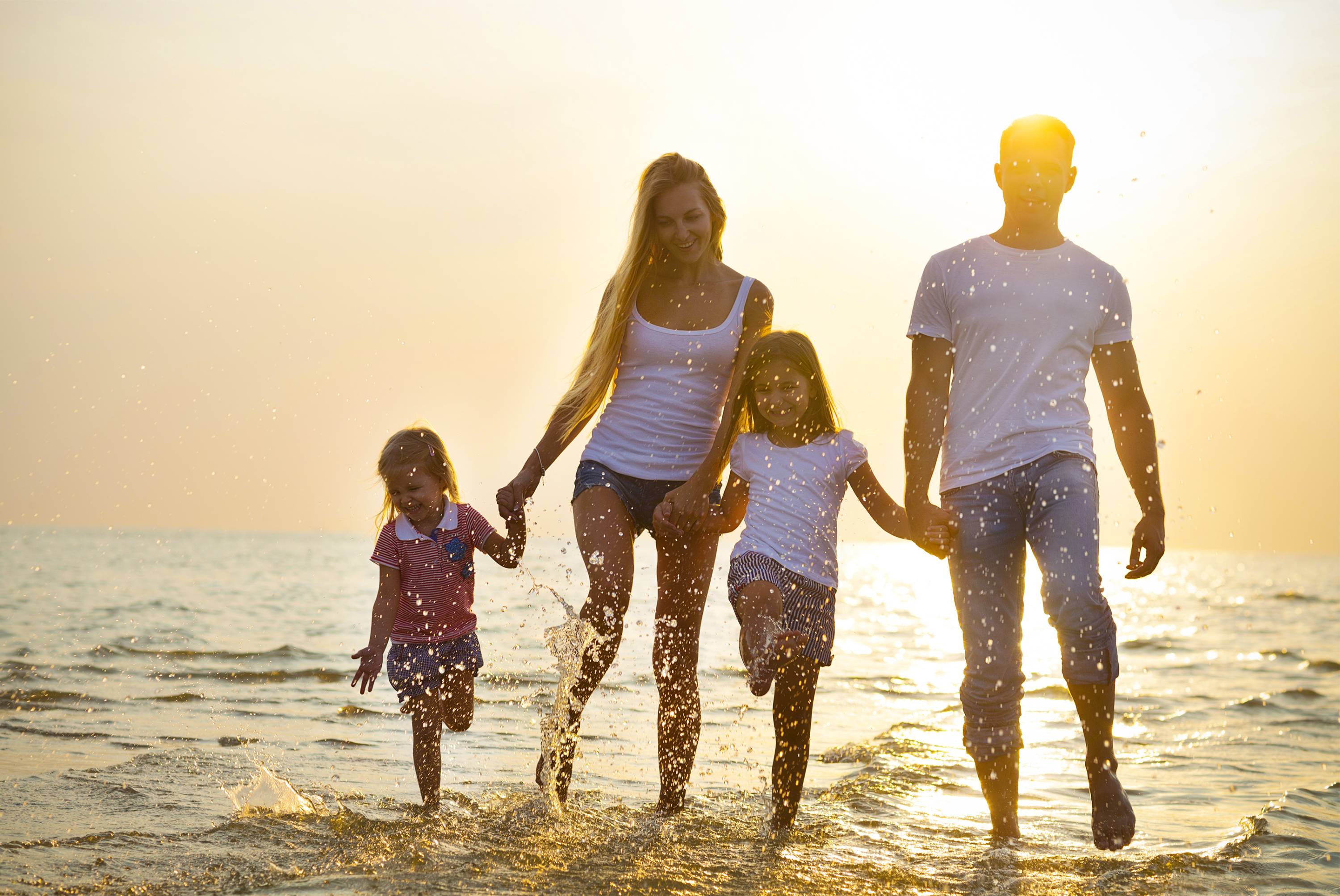 Family playing at the beach