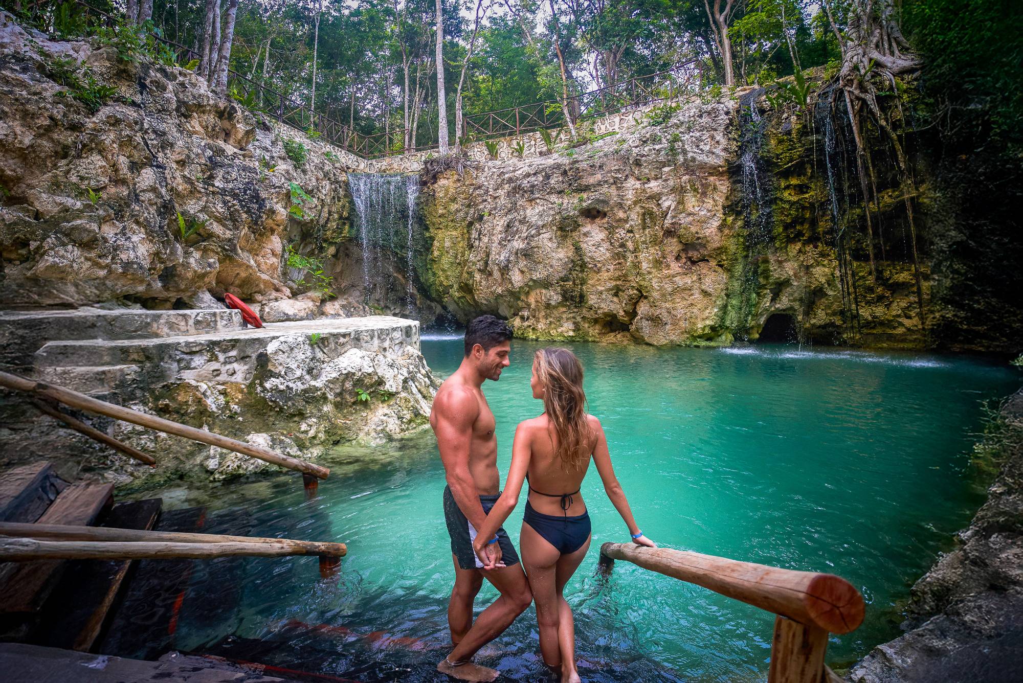 A couple relaxing in the cenote