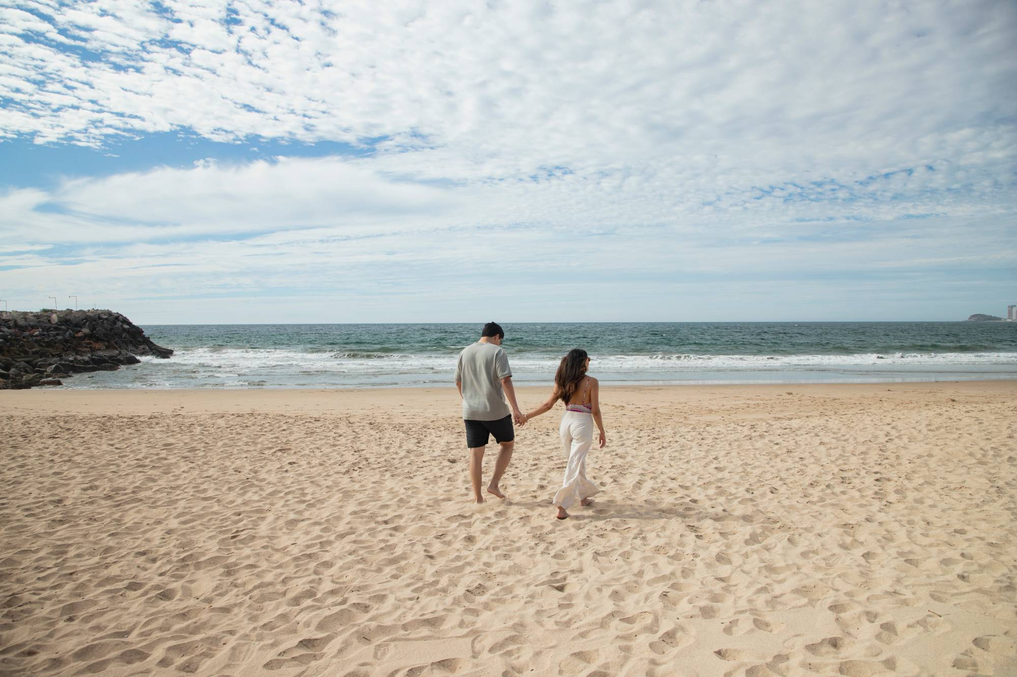 A couple walking at the beach