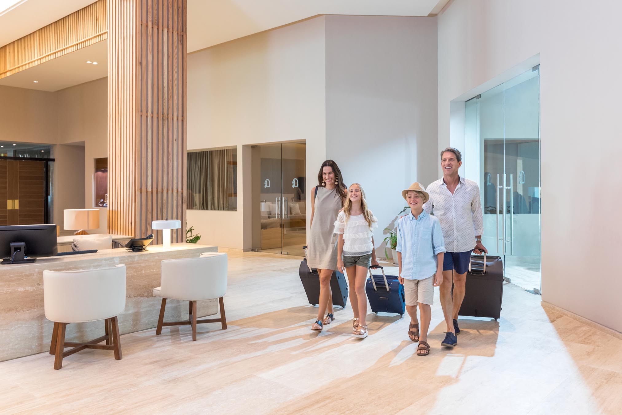 Family Checking In at the All-Inclusive Resort Reception